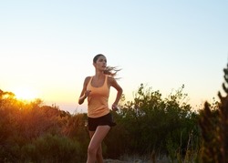 Train like a beast, look like a beauty. Cropped shot of a young woman jogging outdoors.