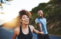 Exercising will only make you feel better. Cropped shot of a happy young couple out for a run together.