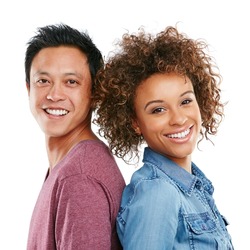 We support each other. Studio portrait of an affectionate young couple standing back to back against a white background.