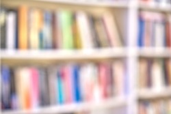 Blurred background of book shelves in a store or school library for copy space. Defocused view of educational material or fictional entertainment for reading and knowledge in community center or swap