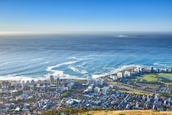 Panoramic landscape view of the city Cape Town in South Africa. Beautiful scenic view of a popular tourist town with greenery and nature during summer. Ocean and residential in the Western Cape