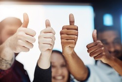 Teamwork, support and trust with a thumbs up from happy colleagues collaborating. Excited partners uniting, showing trust and success with a winning gesture. Community working together towards a
