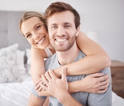 Love, hug and portrait of couple in bedroom relax, bonding and enjoy quality time together in hotel room suite. Peace, smile and calm quiet morning for happy young man and woman on holiday vacation