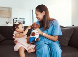 Pediatrician doctor consulting kid, teddy bear and happy healthcare checkup at home visit. Happy baby girl, occupational therapy and woman nurse therapist play in lounge for children wellness service