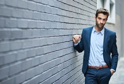 Business fashion, corporate style and man with luxury professional clothes, blue fabric suit and relax on wall. Designer apparel outfit, success and businessman with confident attitude in formal wear