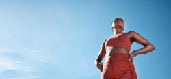 Fitness, black woman and blue sky, mockup and background of vision, mindset and motivation for exercise goals, healthy lifestyle or body wellness. Low angle, female sports athlete and outdoor mock up
