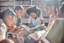 Education, books or students reading in a library for group learning development or growth. Storytelling, kids or happy children talking together for knowledge on funny fantasy stories at school