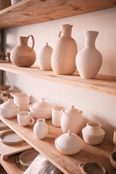 Backgrounds, shelf and pottery in creative workshop, store and manufacturing startup. Ceramics, collection and display in studio, small business and retail craft market, shop and stock production