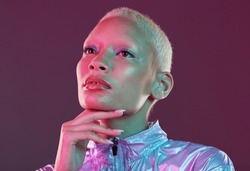 Vaporwave style, black woman and cyberpunk aesthetic with model thinking in a studio. Isolated, glow makeup and futuristic cyber fashion of a young person with chrome clothing and scifi design