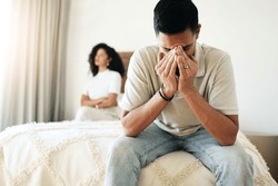 Crying, sad and couple in a conflict in the bedroom about depression, divorce or relationship mistake. Mental health, depressed and man and woman with stress from marriage, fight and argument