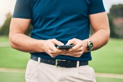 Man, hands and phone texting in communication on golf course for sports, social media or networking outdoors. Hand of sporty male chatting on smartphone or mobile app for golfing research or browsing