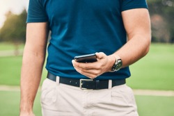 Man, hands and phone in communication on golf course for sports, social media or networking in the outdoors. Hand of sporty male holding smartphone for mobile app, golfing research or browsing
