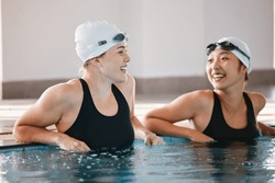 Swimming pool, sports and women laughing in water, joke and funny comedy after exercise. Swimmer, happiness and friends or girls talking, laughter and comic discussion with humor after training.