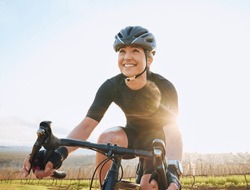 Cycling, fitness and happy with woman in park for training, workout and cardio health. Exercise, travel and freedom with female cyclist riding on bike in nature for adventure, journey and transport