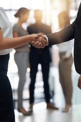 Bussiness people, shaking hands and partnership deal at meeting for networking, b2b and success. Professional man and woman together for handshake, corporate partner and introduction or agreement