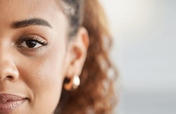 Eye, face and portrait of a woman with space for mockup, advertising or vision on a studio background. Zoom and half headshot of african person or student with natural beauty, focus and concentration