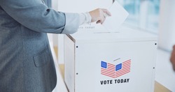 Hand, usa and president election or ballot paper document at poll station, government or choice. Man, fingers and opinion at booth for American campaign or democracy day change, patriotic or vote box