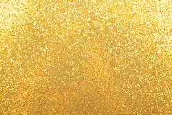 Abstract background texture of shiny golden glitter pattern light gradient