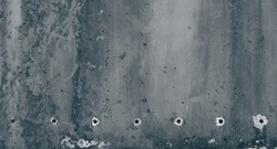 Grunge uneven weathered concrete stone surface texture background with dark stains and drilled boring holes or bullet holes