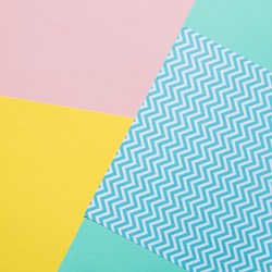 Texture background of fashion pastel colors: pink, yellow, turquoise and geometric pattern papers in minimal concept. Flat lay, Top view. 90s style