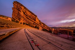 benches at red rocks amphitheater in denver colorado with carnation flowers 