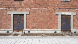 Brick wall background,Industrial background, empty grunge urban street with warehouse brick wall
