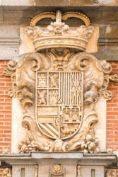 Heraldic shield on the facade of the Casa de la Villa (Villa's House), former Madrid's town hall, at Plaza de la Villa (Villa's square), Madrid old town. Madrid, Spain.