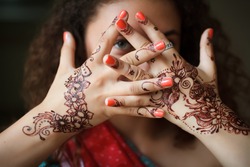 Hands with pattern of henna closeup