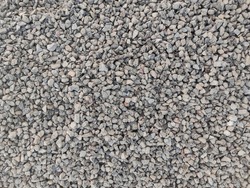 Top view gravel texture. Small road stone background. Dark gravel pebbles stone texture seamless texture.