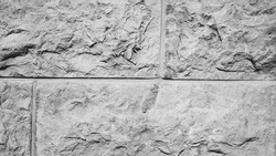 Textured Stone Brick Wall. Black and white photo Background.