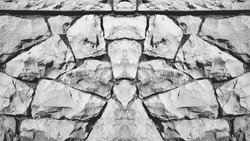 Stone Pattern. Symmetrical Photo Background of Old Vintage Stonewall. Geometrical stone figure. Black and white Photo.