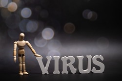 the word Virus at dark background with bokeh. Omikron is the new type of corona virus from South Africa, marked as B.1.1.529