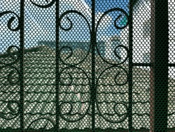 Plastic fence or bird net installed at the window.