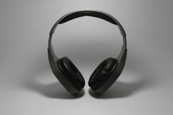 Grey headphones on a white background. Product photo