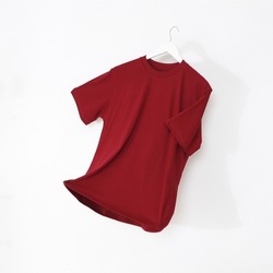 Maroon tshirt with hanger. Flying cotton T-shirt isolated on white background.