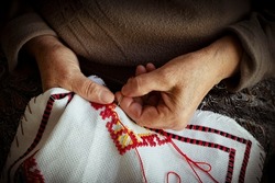 old lady's hands embroidery ornaments