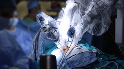Surgical operation robot. Medical operation involving robot. Robotic Surgery. Manipulators performing surgery on humans.