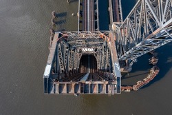 Top down aerial view of a railroad bridge in the vertical lift position
