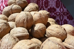 Heap of whole walnuts background. Healthy organic food concept. Natural walnut background pattern texture Abstract walnuts heap pattern background Blurred edges frame Natural food in-shell nuts walnut