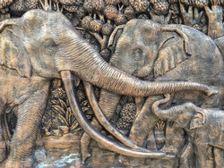 Elephants stone sculpture on the wall in Thailand public temple