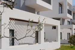new contemporary residential construction architecture background. white modern house facade exterior