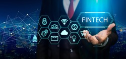 Fintech (financial technology) concept. Business person hold fintech illustration and icon technology.5G network wireless systems.IoT(Internet of Things), ICT,communication network concept.
