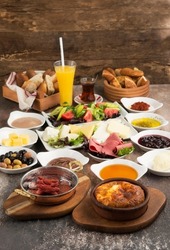 Traditional turkish breakfast, bright lunch, still life of food and vegetables, white dishes, food composition, egg, tomatoes, cucumber, olive, cheese, honey, bread. Turkish spread breakfast. Brunch
