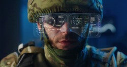 Close-up of a soldier using high-tech sunglasses with holographic display