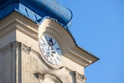 Close up on Church clocktower steeple of the serbian orthodox church of Vlajkovac, Voivodina, Serbia with its iconic clock indicating the time. Vlajkovac is one of the main cities of Serbian Banat.