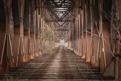 Selective blur on an abandoned steel bridge, stari zeleznicki most, or old railway bridge, in Belgrade, Serbia, with rusted beams. It used to be a train line connecting the center of the city. 