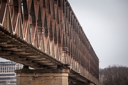 Selective blur on an abandoned steel bridge, stari zeleznicki most, or old railway bridge, in Belgrade, Serbia, with rusted beams. It used to be a train line connecting the center of the city. 