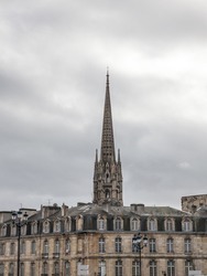 Panorama of the old town of Bordeaux, France, with the the tower of the Basilique Saint Michel basilica a cloudy afternoon in winter. it is a gothic catholic cathedral basilica.