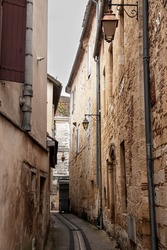 Face of medieval houses in a narrow street of a french medieval village and city, bergerac, in France, in the region of Dordogne and Perigord, with a typical of the Southwestern French architecture.

