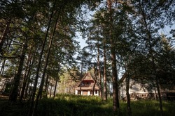 Residential house, a mountain chalet building, called vikendica, in the middle of a mountain forest made of pine trees in the Balkans in Divcibare, Serbia, one of the Serbian ski resorts.